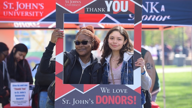St. John's Students holding Thank You sign for donors